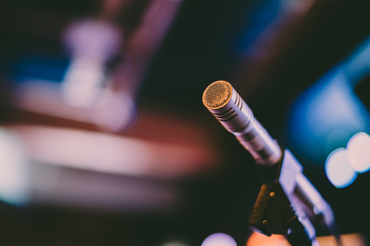 Detailed shot of a microphone with artistic bokeh background, ideal for concerts.